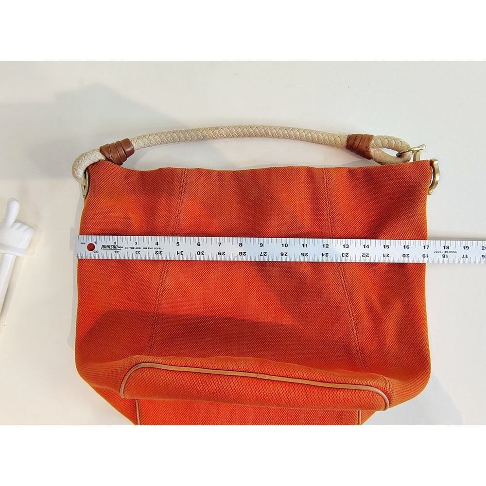 Michael Kors Marina hobo bag features an orange canvas body with braided rope... - Picture 10 of 11